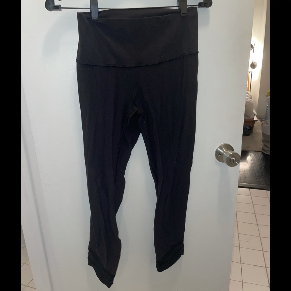 Lululemon black leggings w/ mesh stripes on bottom